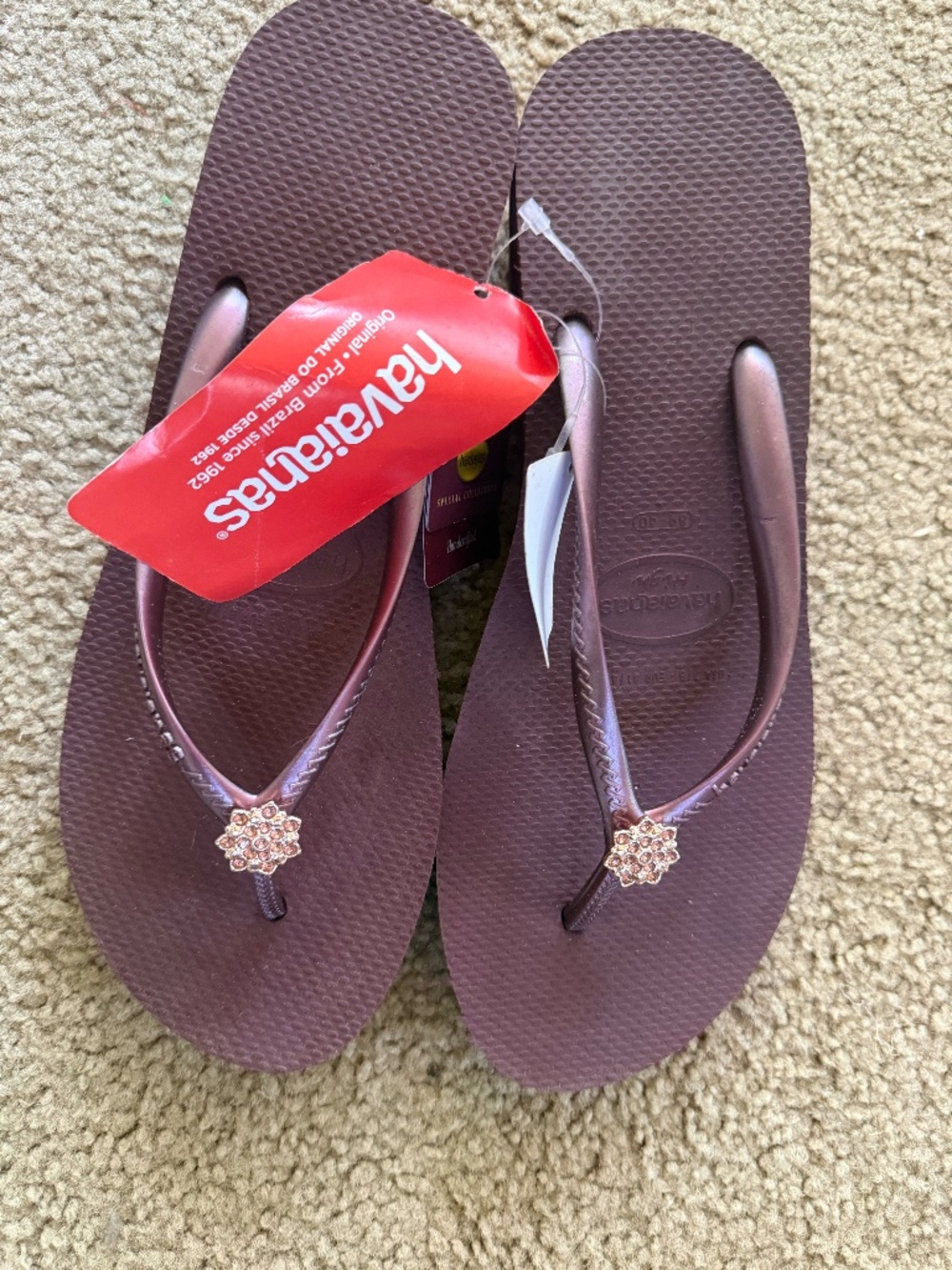 Havaianas Brown Flip Flop Sandals with Rose Gold Flower Accents